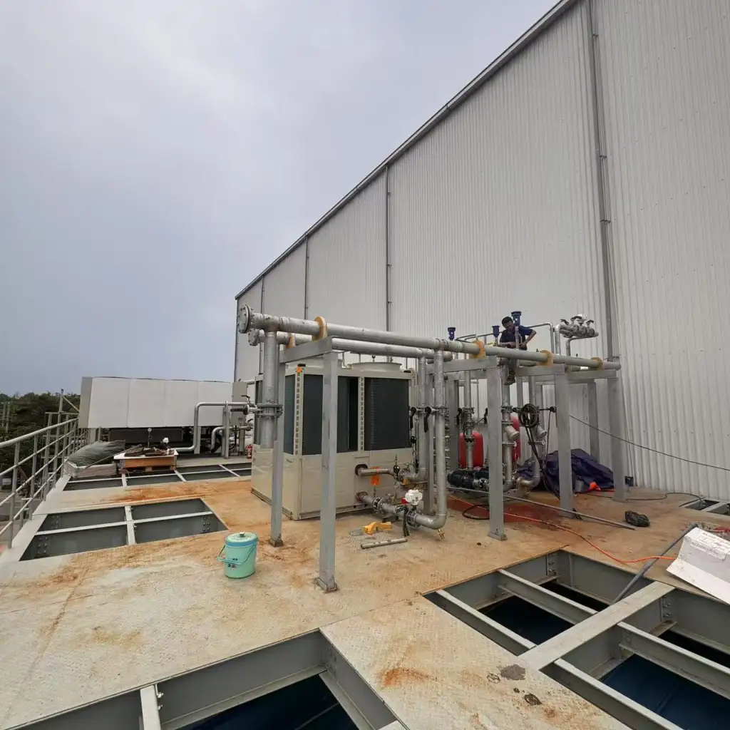 Rooftop air-cooled chiller plant and industrial HVAC piping installation in Brisbane, Australia.